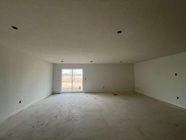 empty room featuring concrete flooring