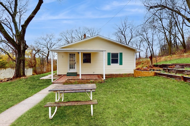 back of property with a yard