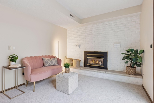 living room featuring carpet flooring and a fireplace