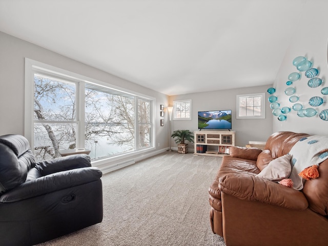 carpeted living room featuring baseboards