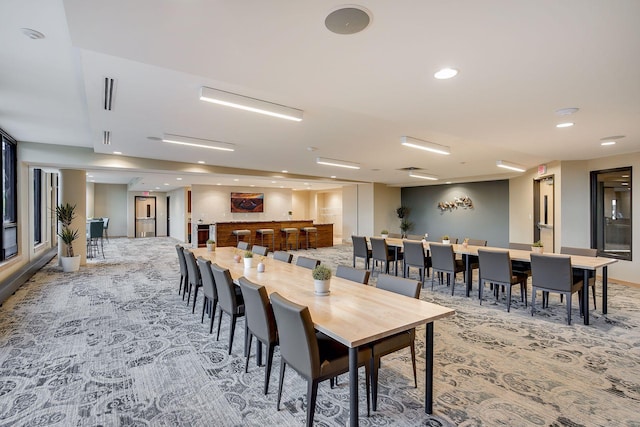 carpeted dining space featuring recessed lighting
