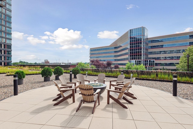 view of patio / terrace featuring an outdoor fire pit