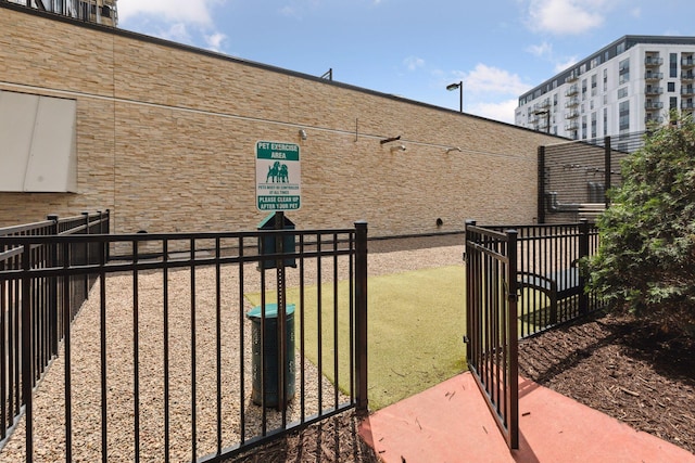 view of gate featuring fence