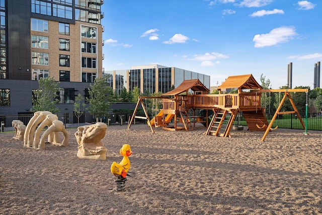communal playground featuring fence