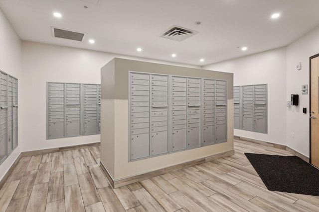 view of property's community featuring visible vents and mail area