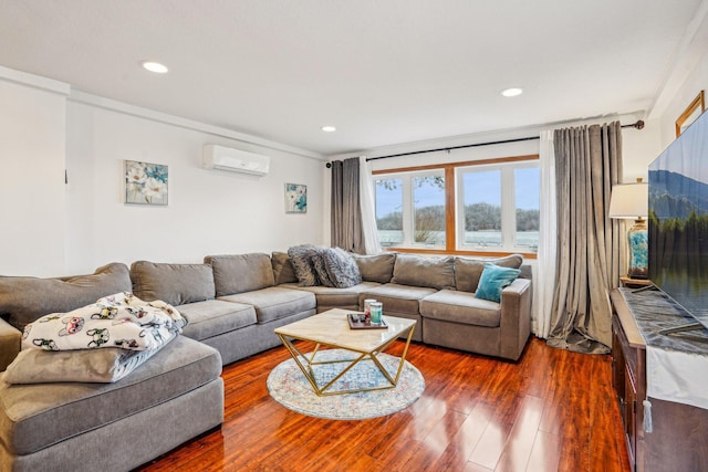 living area featuring an AC wall unit, recessed lighting, and dark wood finished floors