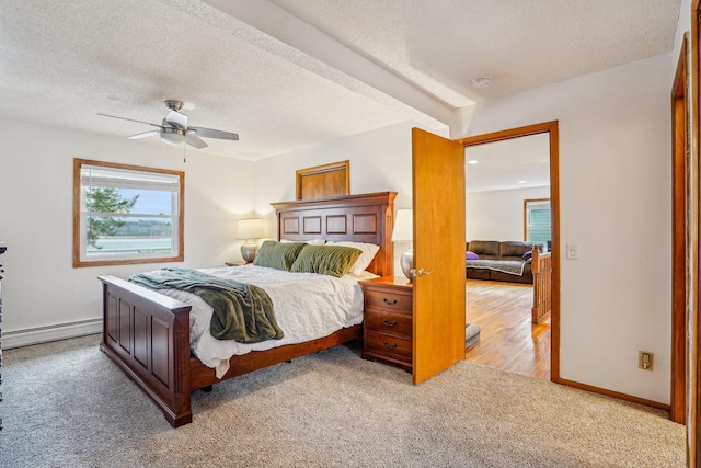 6224 Red Oak Rd, Mound, MN 55364 - bedroom featuring baseboard heating, carpet, a textured ceiling, a ceiling fan, and beamed ceiling