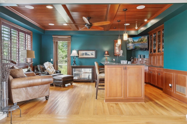 bar with wood ceiling, a ceiling fan, wet bar, visible vents, and light wood-style flooring