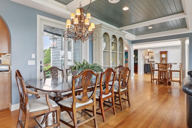 dining area with arched walkways, beam ceiling, a chandelier, and light wood-style flooring