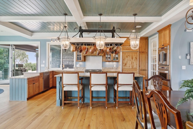 kitchen with an inviting chandelier, beamed ceiling, light wood finished floors, and dishwasher