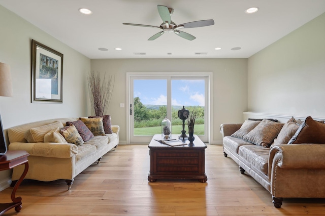 living room with light wood-style floors, a ceiling fan, recessed lighting, and visible vents