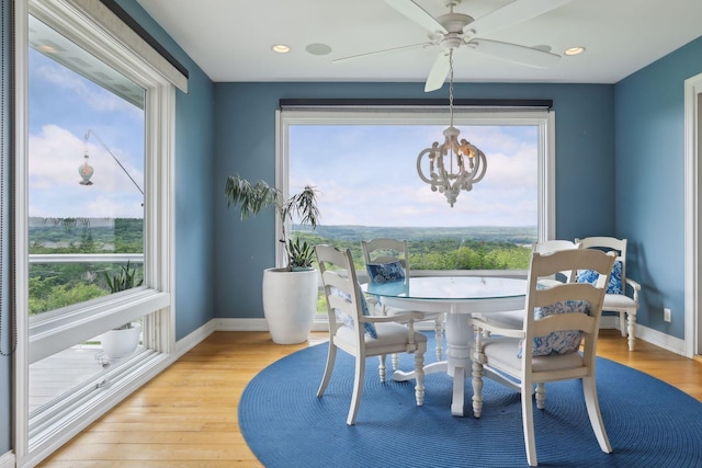 dining area featuring baseboards, plenty of natural light, and light wood-style floors