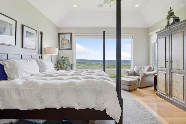 bedroom with recessed lighting, light wood-style flooring, and lofted ceiling