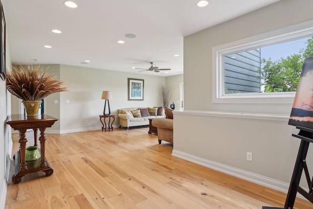 interior space with recessed lighting, baseboards, ceiling fan, and light wood-style flooring