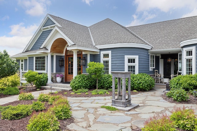 view of front of home with roof with shingles