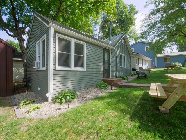1321 Darling Dr NW, Alexandria, MN 56308 - exterior space featuring a lawn and cooling unit