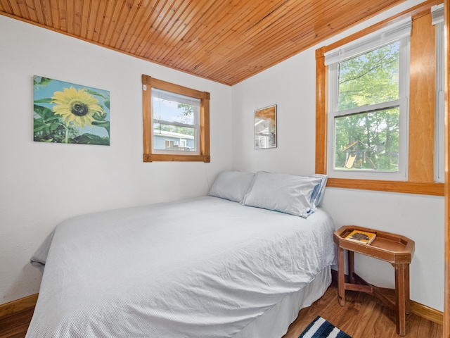 1321 Darling Dr NW, Alexandria, MN 56308 - bedroom featuring baseboards, wood finished floors, and wood ceiling