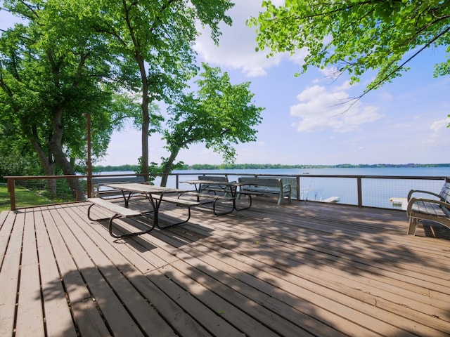 1321 Darling Dr NW, Alexandria, MN 56308 - wooden deck featuring outdoor dining area and a water view
