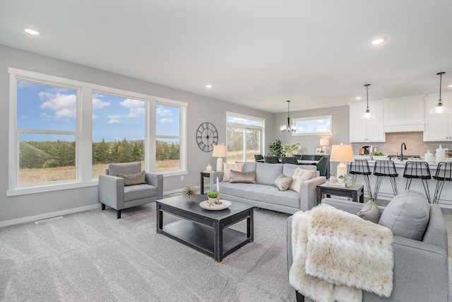 21057 Tippecanoe St NE, East Bethel, MN 55011 - living room featuring recessed lighting, a chandelier, and light carpet