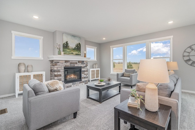 21057 Tippecanoe St NE, East Bethel, MN 55011 - living room with light colored carpet, a fireplace, and recessed lighting