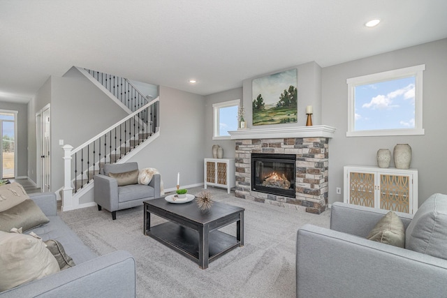 21057 Tippecanoe St NE, East Bethel, MN 55011 - living area with a fireplace, stairs, carpet flooring, and recessed lighting