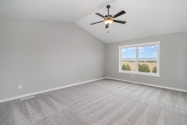21057 Tippecanoe St NE, East Bethel, MN 55011 - carpeted empty room with lofted ceiling and a ceiling fan
