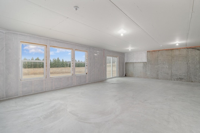 21057 Tippecanoe St NE, East Bethel, MN 55011 - spare room with concrete floors