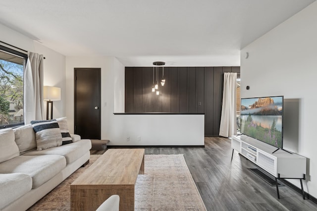 living area featuring dark wood-type flooring