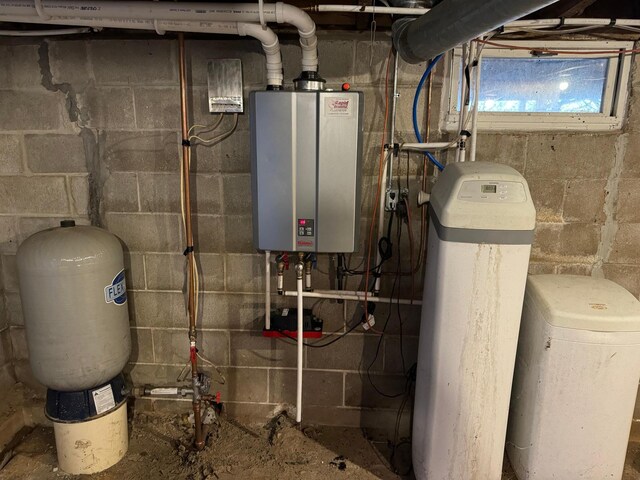 utility room featuring tankless water heater