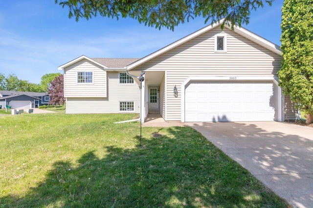 3865 Westbury Ln, Eagan, MN 55123 - view of front of home featuring driveway, a front yard, and a garage
