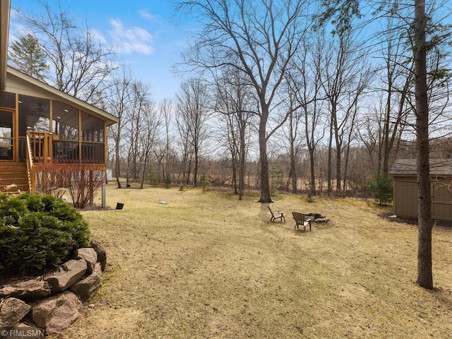 view of yard with a sunroom
