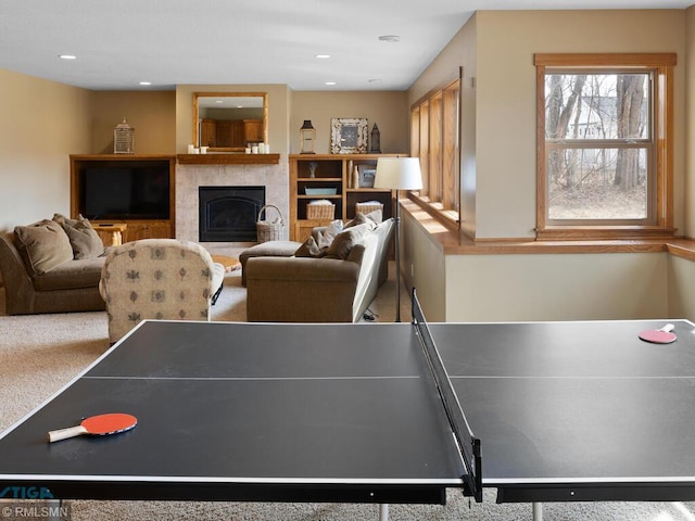 playroom featuring recessed lighting and a tile fireplace