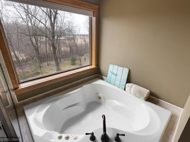 full bathroom with a whirlpool tub