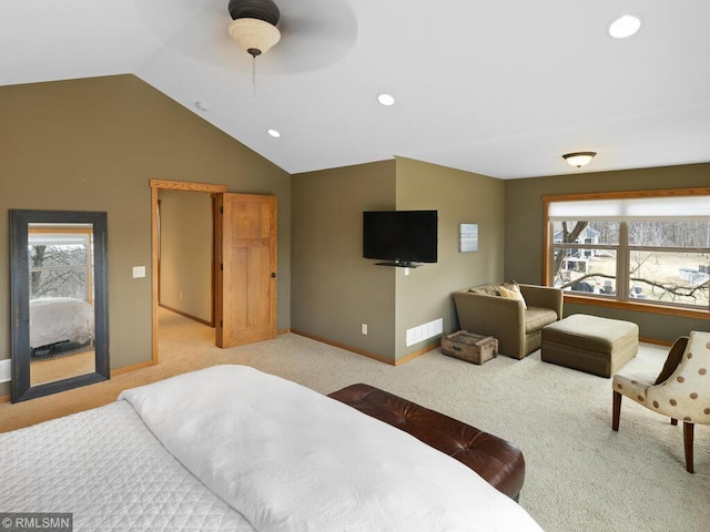 bedroom featuring lofted ceiling, visible vents, baseboards, carpet, and multiple windows