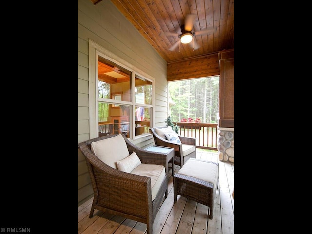 sunroom / solarium with an outdoor hangout area and a ceiling fan