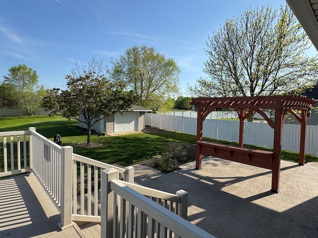 view of patio with a pergola and an outbuilding