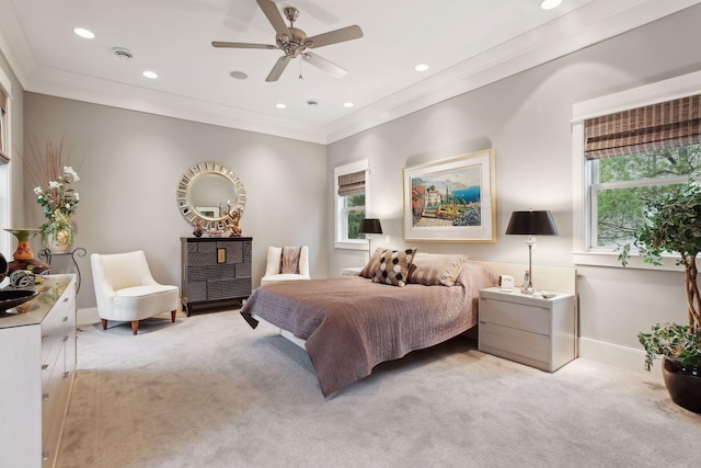 bedroom with ornamental molding, multiple windows, and light carpet