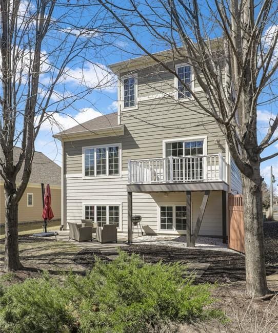 2923 124th Cir NE, Blaine, MN 55449 - rear view of property featuring an outdoor living space, a patio area, and a balcony