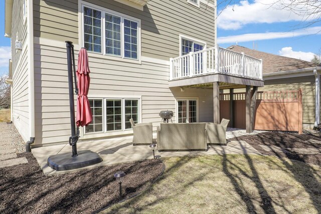 2923 124th Cir NE, Blaine, MN 55449 - back of property featuring a balcony and a patio area