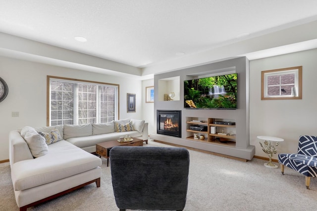 2923 124th Cir NE, Blaine, MN 55449 - carpeted living room with plenty of natural light, baseboards, and a glass covered fireplace