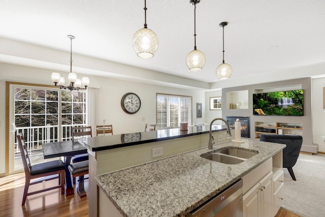 2923 124th Cir NE, Blaine, MN 55449 - kitchen with a sink, dishwasher, open floor plan, and light wood finished floors