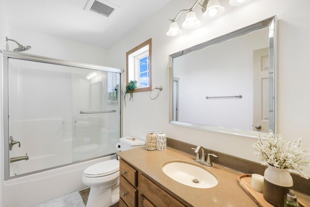 2923 124th Cir NE, Blaine, MN 55449 - full bathroom featuring toilet, vanity, and combined bath / shower with glass door