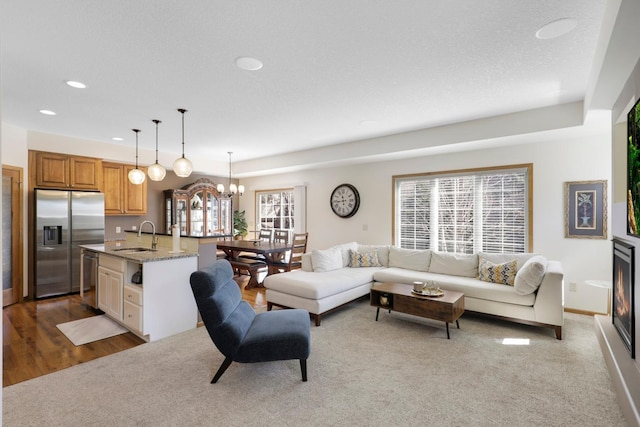 2923 124th Cir NE, Blaine, MN 55449 - living area with recessed lighting, a chandelier, light colored carpet, and baseboards