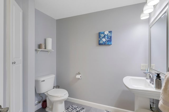 2923 124th Cir NE, Blaine, MN 55449 - half bathroom with tile patterned flooring, toilet, and baseboards