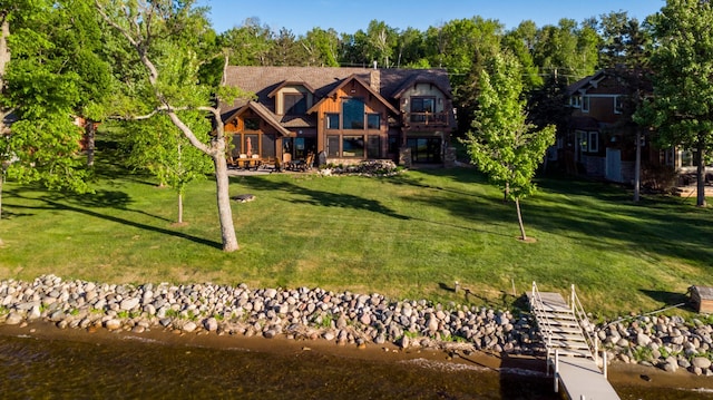 1156 Green Gables Rd, East Gull Lake, MN 56401 - view of front of home featuring a front yard and a water view