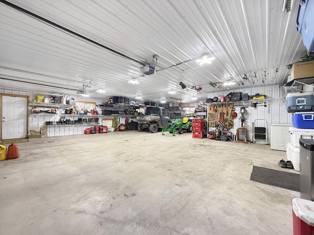 4886 Feelinrite Ln NW, Eckles Twp, MN 56601 - garage with a garage door opener and a workshop area