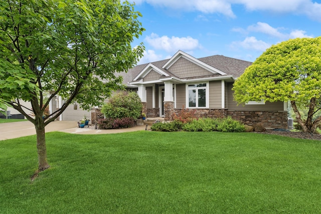 17623 Grist Ct SW, Prior Lake, MN 55372 - craftsman-style home featuring concrete driveway, a front yard, and stone siding