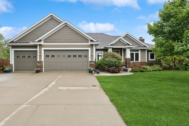 17623 Grist Ct SW, Prior Lake, MN 55372 - craftsman-style home featuring driveway, a front yard, a garage, and stone siding