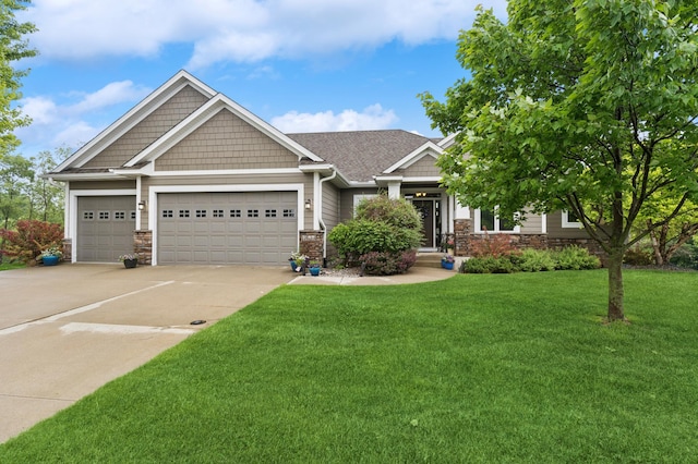 17623 Grist Ct SW, Prior Lake, MN 55372 - craftsman-style house featuring a garage, driveway, a front lawn, and stone siding