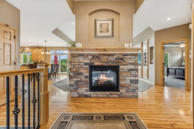17623 Grist Ct SW, Prior Lake, MN 55372 - living area featuring light wood-style flooring, a fireplace, ceiling fan, and baseboards